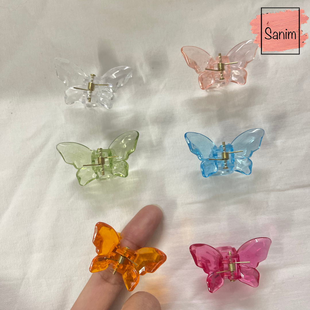 Mini butterfly hair clips ( per piece)(بالقطعه)